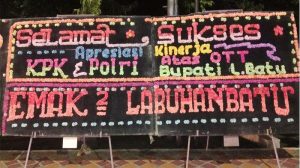 Papan Bunga dan Ketawa Mengiringi  OTT KPK  Bupati Labuhanbatu EAR Dialamatkan Kepada Siapa ?